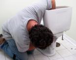 Plumber repairing a toilet float valve assembly